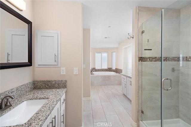 bathroom featuring vanity, tile patterned floors, and plus walk in shower