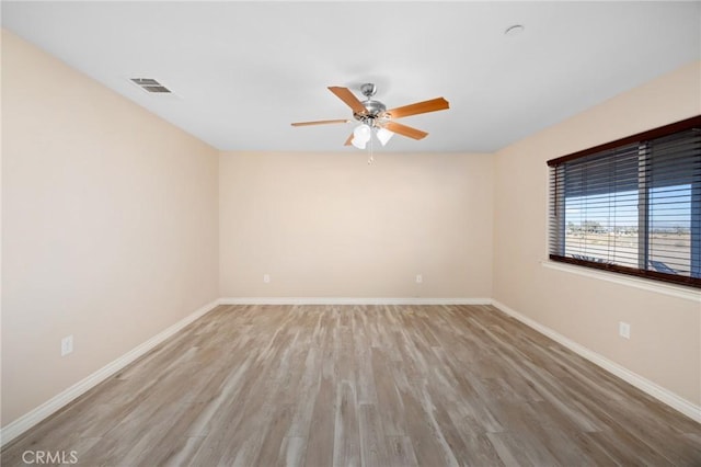 unfurnished room featuring hardwood / wood-style flooring and ceiling fan