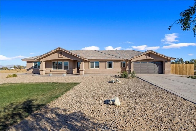 ranch-style home featuring a garage