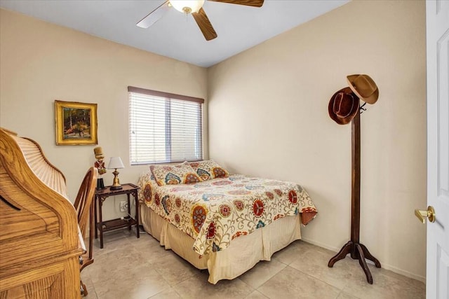 tiled bedroom featuring ceiling fan