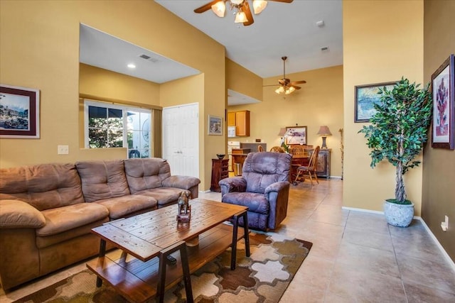 tiled living room with ceiling fan