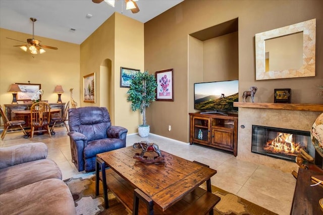 tiled living room featuring ceiling fan