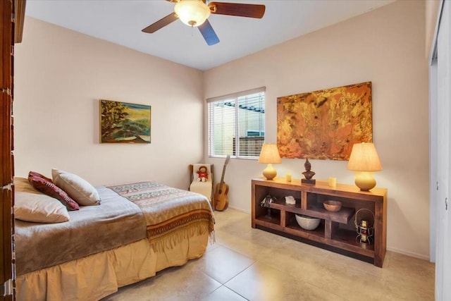 tiled bedroom with ceiling fan