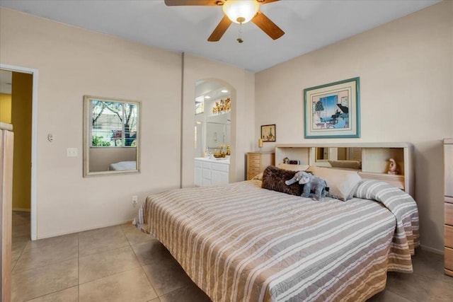 tiled bedroom with ceiling fan