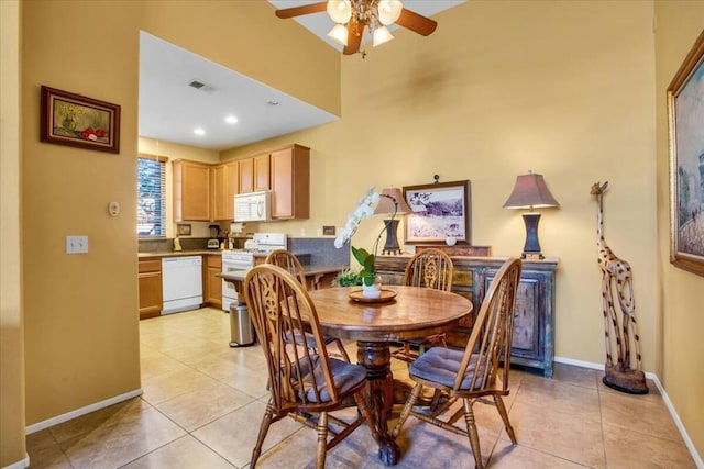 dining room with ceiling fan and light tile patterned floors