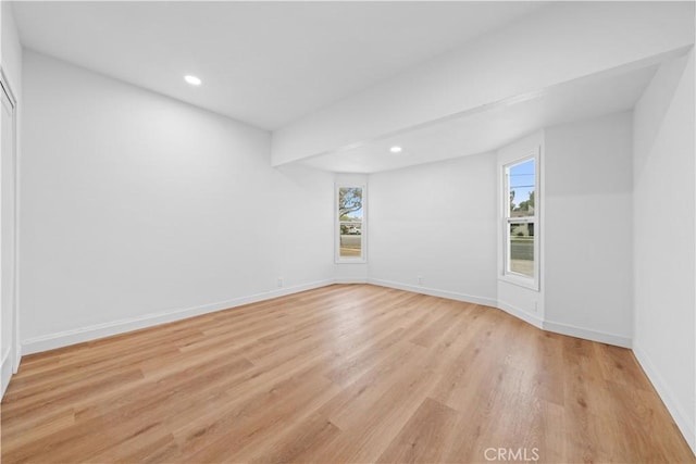 spare room featuring light hardwood / wood-style flooring