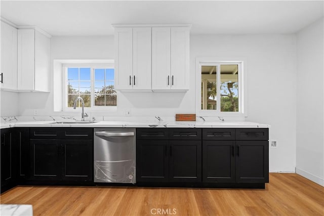 kitchen with light hardwood / wood-style floors, sink, white cabinetry, and dishwasher