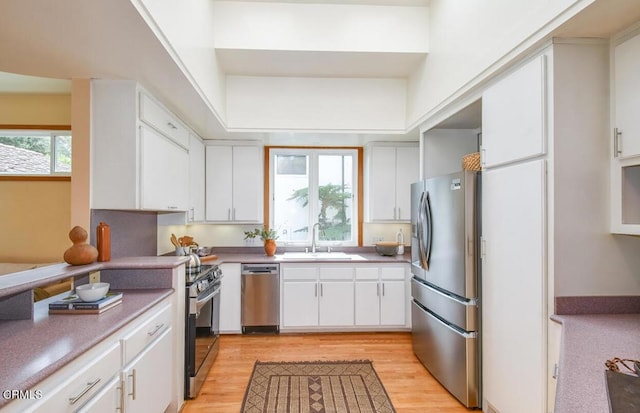 kitchen featuring white cabinets, sink, and stainless steel appliances