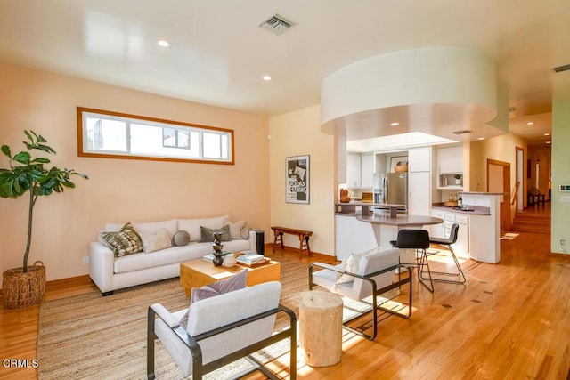 living room with light hardwood / wood-style floors