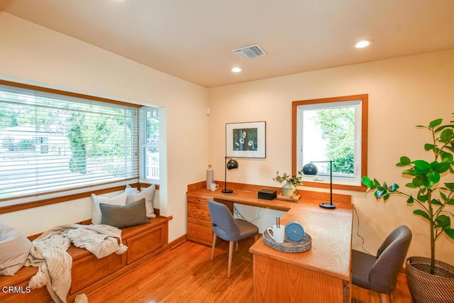 office area with light hardwood / wood-style floors