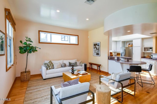 living room with light hardwood / wood-style floors