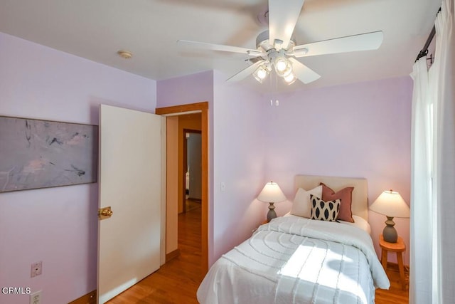 bedroom featuring light wood-type flooring and ceiling fan