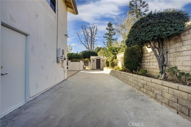 view of side of home with a patio area