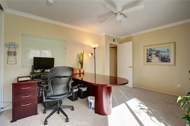 carpeted office with a textured ceiling, ceiling fan, and ornamental molding