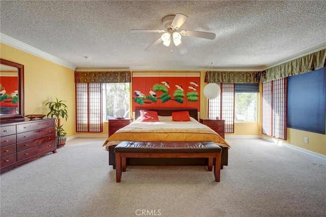 carpeted bedroom featuring ceiling fan, ornamental molding, and a textured ceiling