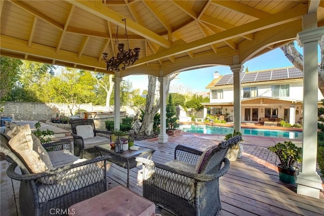 view of patio featuring a gazebo, an outdoor living space, and a swimming pool side deck