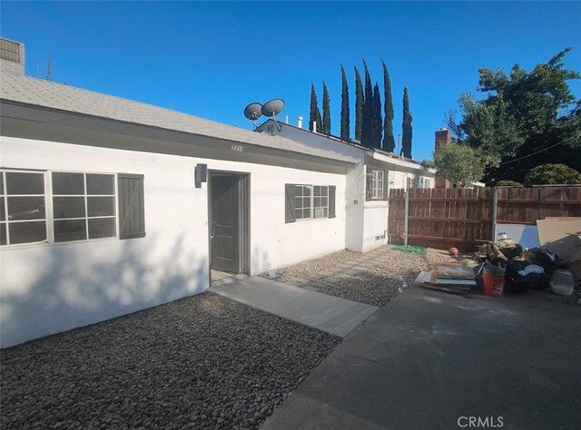 7716 Owensmouth Ave, Canoga Park, CA 91304 - property entrance with stucco siding and a patio area