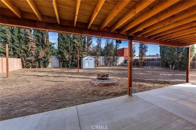 7716 Owensmouth Ave, Canoga Park, CA 91304 - fenced backyard with a fire pit and a patio area