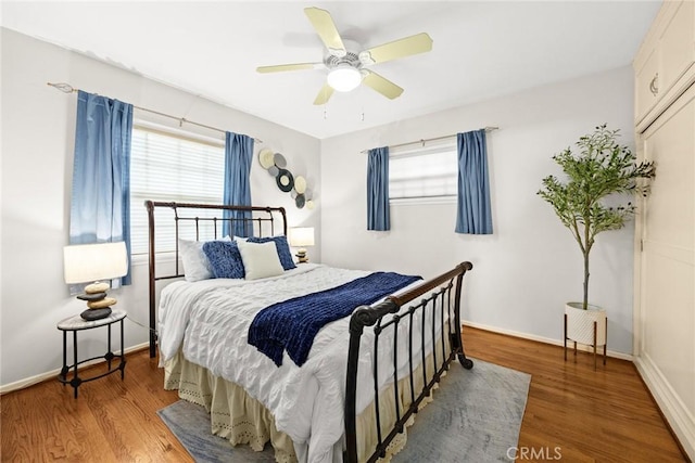 bedroom featuring ceiling fan and hardwood / wood-style flooring