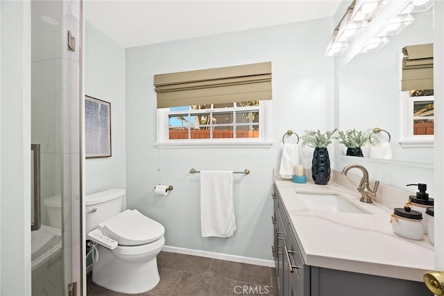 bathroom with toilet, a shower with door, tile patterned floors, and vanity