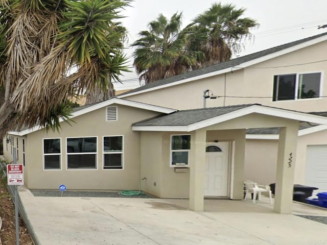 back of property with a patio area