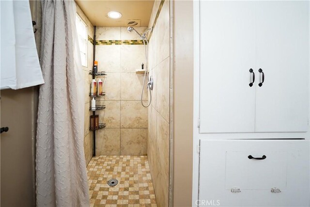 bathroom with a shower stall