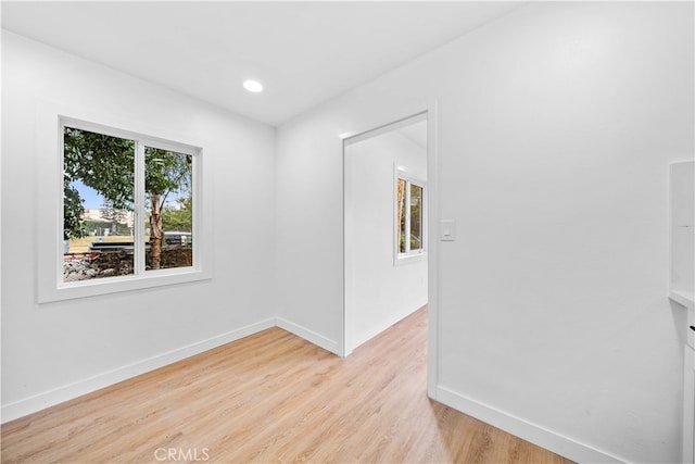 spare room with light wood-type flooring