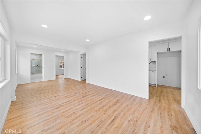 unfurnished living room featuring light wood-type flooring