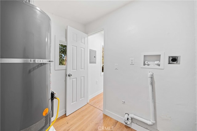 washroom featuring wood-type flooring, electric dryer hookup, hookup for a washing machine, and electric panel