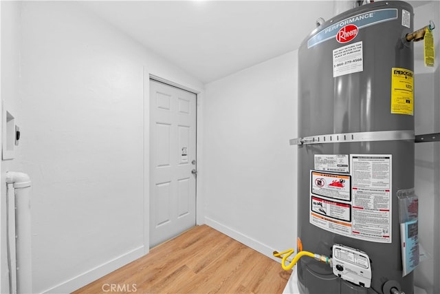 utility room featuring water heater