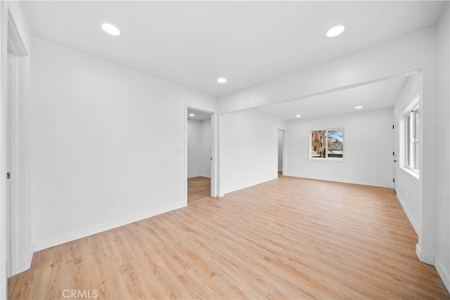 unfurnished living room featuring light hardwood / wood-style floors