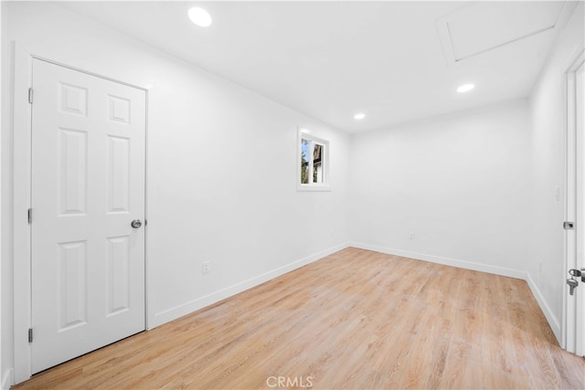 empty room with light hardwood / wood-style flooring