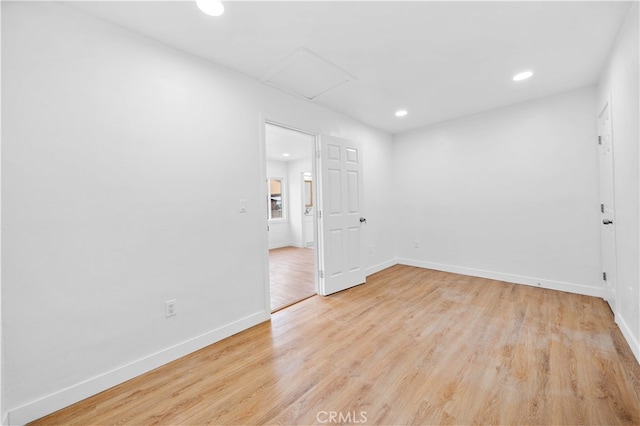 unfurnished room with light hardwood / wood-style flooring