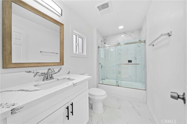 full bathroom featuring toilet, bath / shower combo with glass door, and vanity