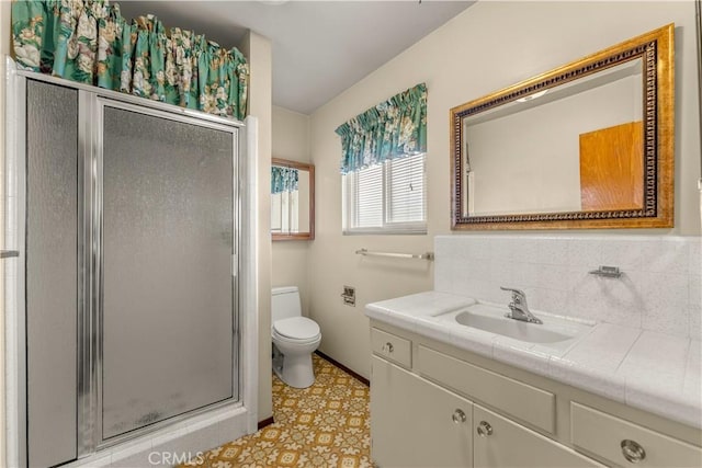 bathroom with toilet, walk in shower, and vanity