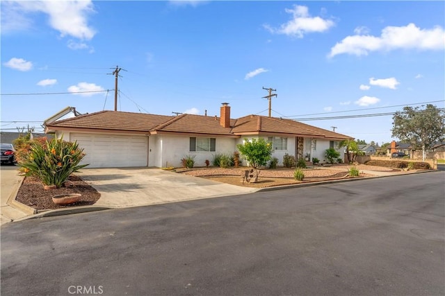 ranch-style house featuring a garage