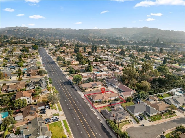 drone / aerial view featuring a mountain view