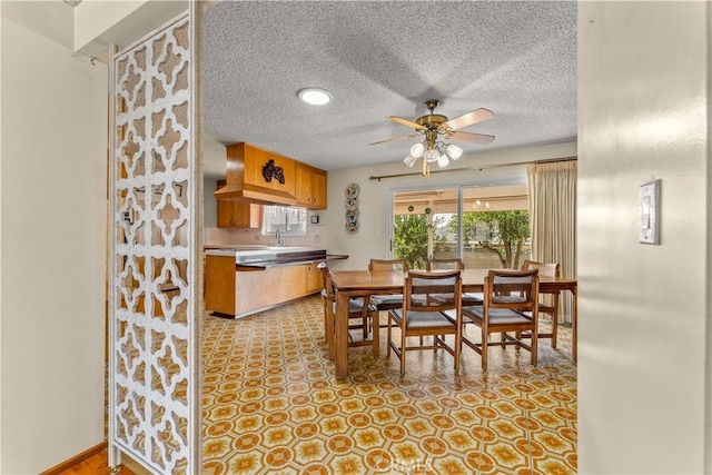 dining area with ceiling fan