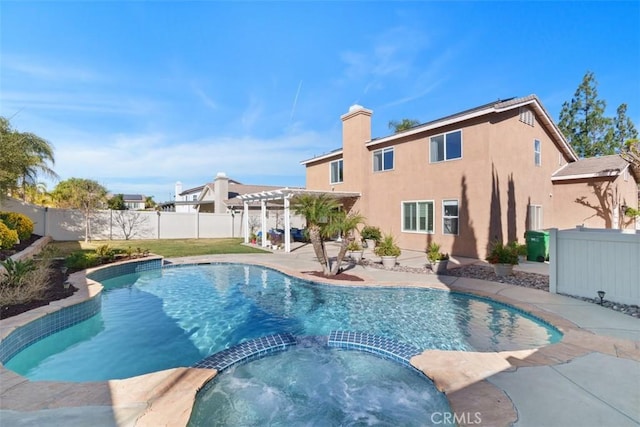 view of swimming pool featuring a pergola and an in ground hot tub