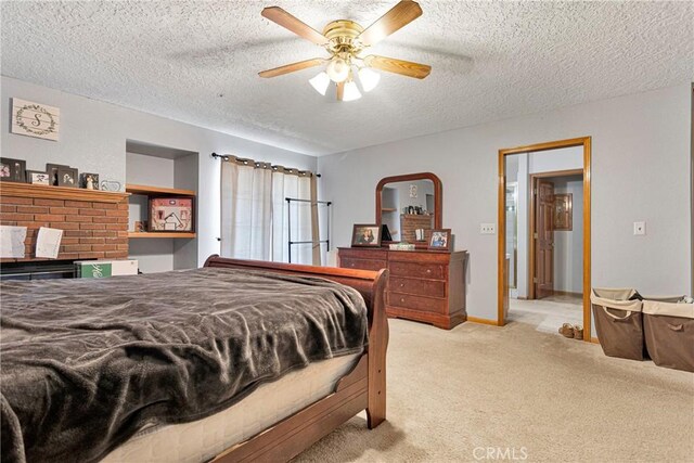 bedroom featuring ceiling fan, light colored carpet, and a textured ceiling