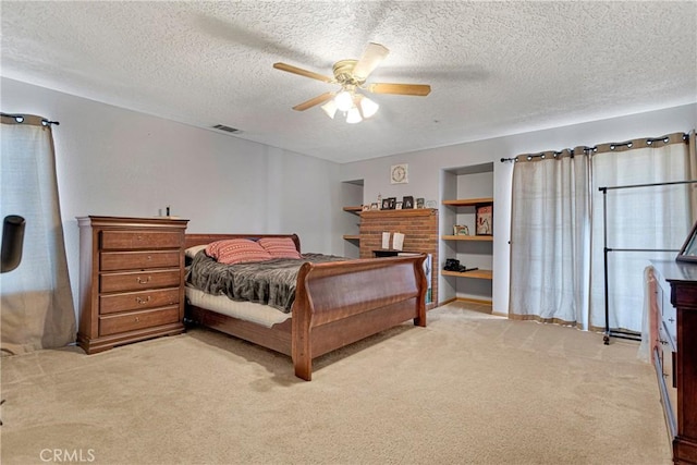 10187 Mesquite St, Oak Hills, CA 92344 - bedroom featuring light carpet, a textured ceiling, and a ceiling fan