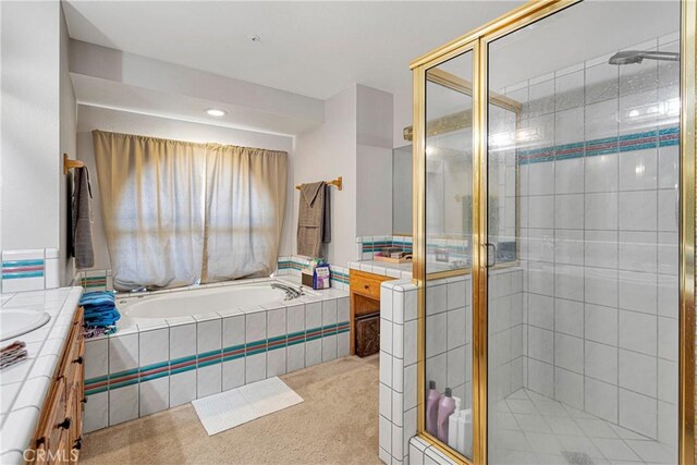 10187 Mesquite St, Oak Hills, CA 92344 - full bathroom with vanity, a stall shower, and a garden tub