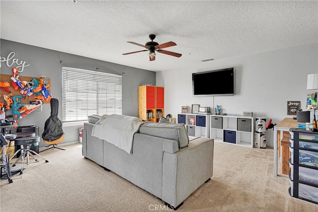 10187 Mesquite St, Oak Hills, CA 92344 - living area with carpet floors, a ceiling fan, and a textured ceiling