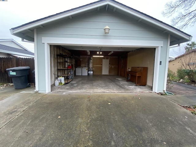 garage with washer and clothes dryer