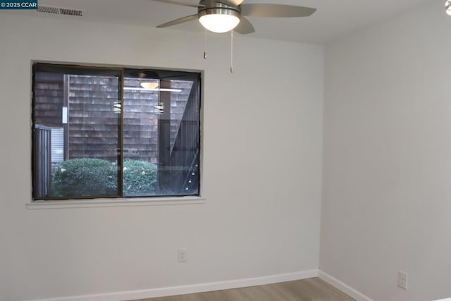 unfurnished room featuring ceiling fan and light hardwood / wood-style floors