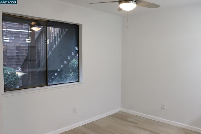 spare room featuring ceiling fan and hardwood / wood-style floors