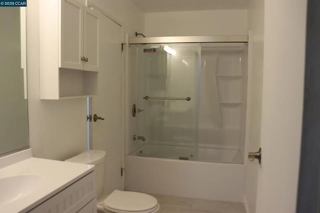 full bathroom with combined bath / shower with glass door, vanity, and toilet