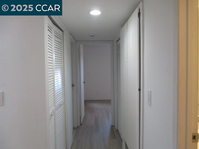 hallway featuring light wood-type flooring