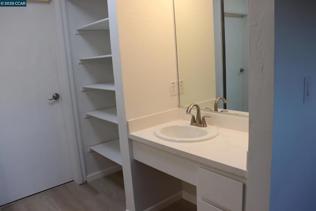 bathroom featuring hardwood / wood-style floors and vanity