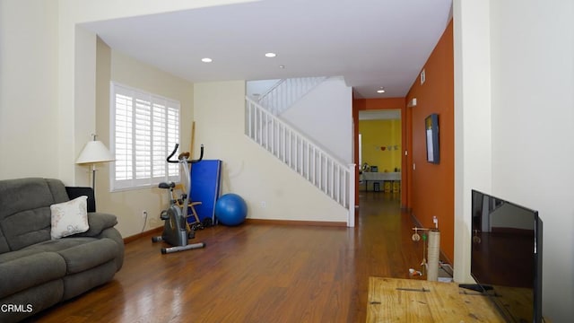 workout room with dark wood-type flooring